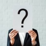 depositphotos_295901236-stock-photo-cropped-view-woman-holding-placard